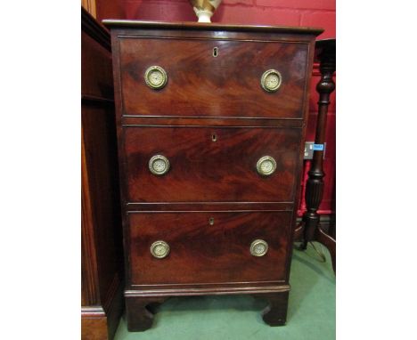 A small mahogany chest of three drawers on bracket feet, with brass ring handles. 89cm x 53cm x 51cm 