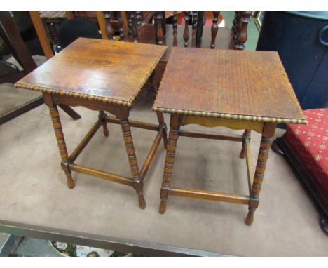 A pair of small oak side tables with beaded edging and bobbin turned supports, 39cm tall 