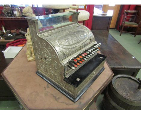 NCR National Cash Register, model 35, ca. 1910. Nickel plated case, Dolphin pattern. Mostly original glass key-checks 