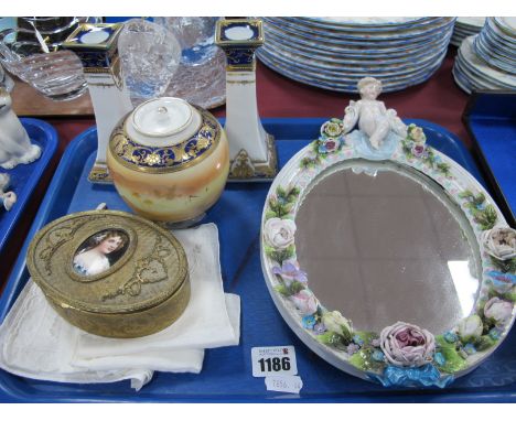 Continental Porcelain Oval Framed Free Standing Dressing Mirror, with applied floral decoration and cherub atop (damages) 30c