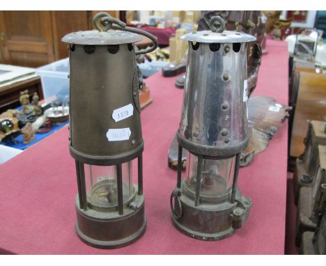 Protector Lamp &amp; Lighting Co, Eccles Miners Lamp in brass, another lacking label.