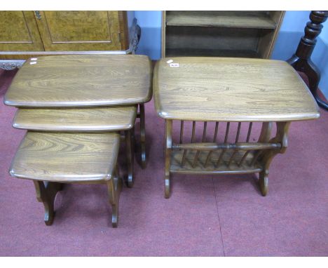 Ercol Nest of Tables, with trestle ends; together with an Ercol magazine rack. (2)