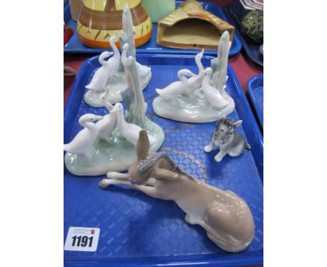 Lladro Donkey, three Nao geese figures and a porcelain dog figure:- One Tray