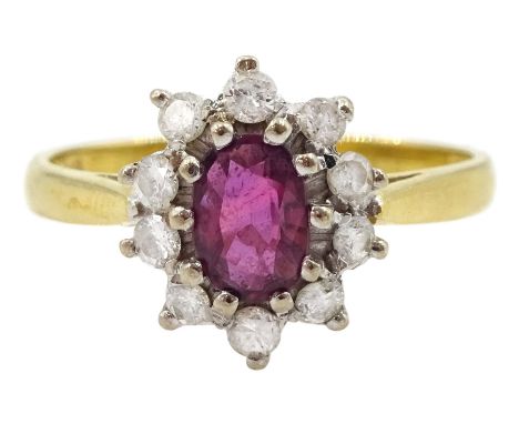 18ct gold oval ruby and round brilliant cut diamond cluster ring, London 1982Condition Report:Approx 3.08gm, size M, head = 1