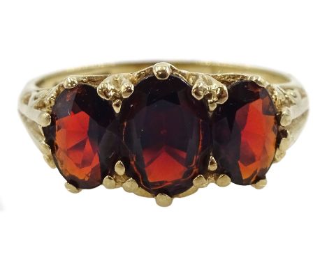 9ct gold three stone oval garnet ring, London 1985Condition Report:Approx 2.6gm, size K, max depth = 7mm, well presented ring