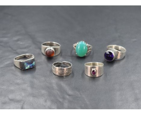 Six silver rings of various forms including artisan made by Sidney Beddall of Ambleside, Mexican abalone shell, amethyst etc