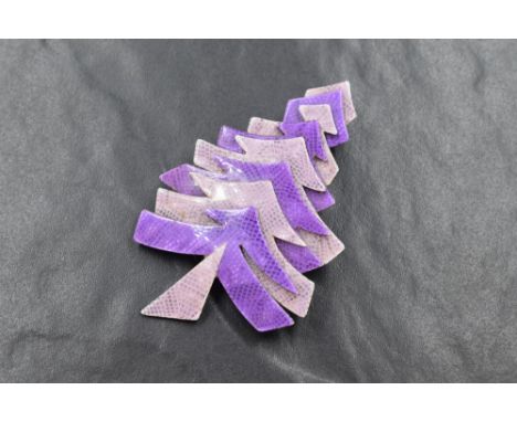 A Lea Stein of Paris laminated celluloid Christmas tree brooch in shades of purple