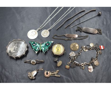 A small selection of silver and white metal jewellery including ID bracelets, locket brooch, silver watch (no strap), Alpine 