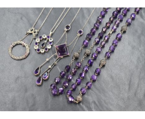 Five vintage white metal necklaces including a marcasite and enamel wreath style necklace, a similar white and purple stone o