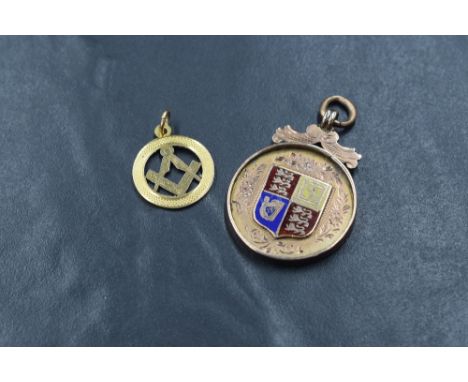 A 9ct rose gold medallion having enamelled Royal Coat of Arms shield to front and monogram en verso, marked 375, and a small 