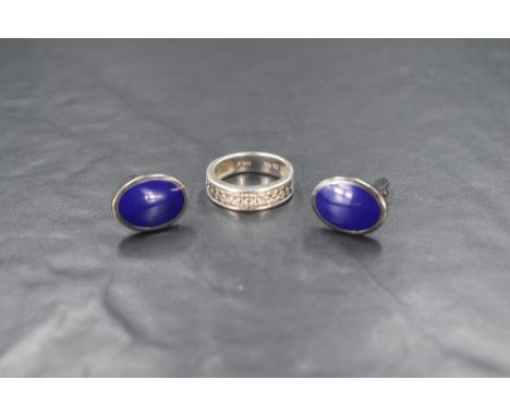 A pair of silver and enamel cufflinks, the oval panels having blue enamel, along with a silver pave set cubic zirconia half e