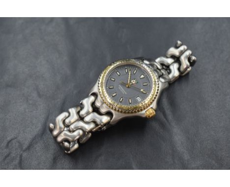 A 1990's Tag Heuer quartz wrist watch, model: WG1220-KO having a baton numeral dial with date aperture on a black face with g