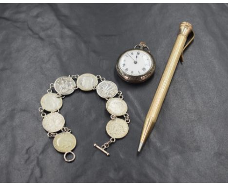 A small Continental silver top wound pocket watch having a Roman numeral dial to a decorative enamel face in a moulded and en