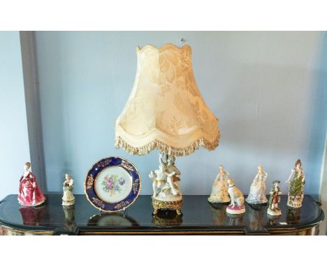 Nine assorted ceramic items including a Victorian bisque porcelain seated greyhound, Coalport and other figures, and a gilt m