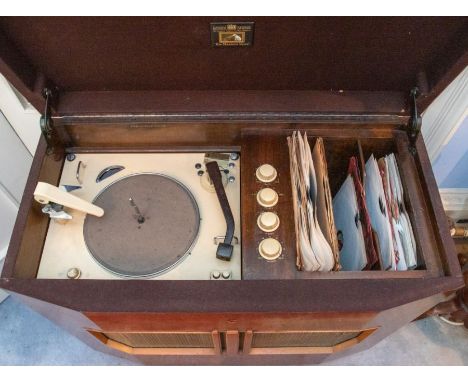 An HMV record player, model No. 2000 & Serial No. R/12 3847, with white enamelled deck, in a walnut art deco cabinet, 85.5 cm