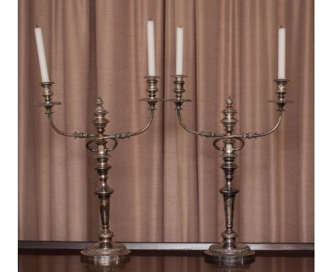 A large pair of Sheffield plate candelabra, 19th century, with weighted candlestick stems and a two whiplashed branch/three l