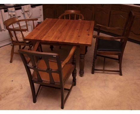 An oak and pine rectangular table, with turned and fluted associated legs,100cm by 107cm: Two carver chairs and two stick bac