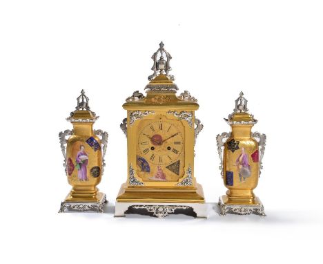 ‡A French porcelain inset gilt and silvered brass mounted clock garniture in the Far Eastern taste, circa 1880, the eight-day