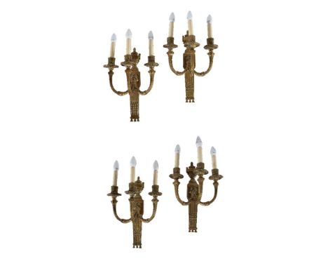 A set of four gilt metal three light wall appliques in Neoclassical taste, early 20th century, the foliate cast sconces on sq