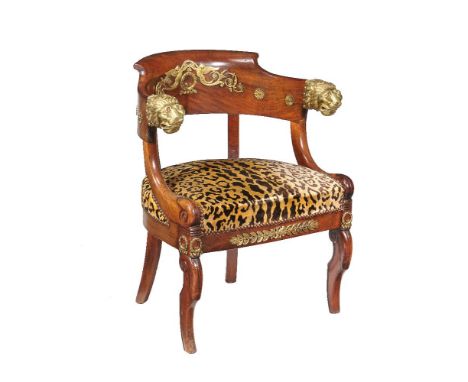 A Louis Philippe mahogany and gilt metal mounted armchair, circa 1840, with later leopard print upholstery, 80cm high, 59cm d