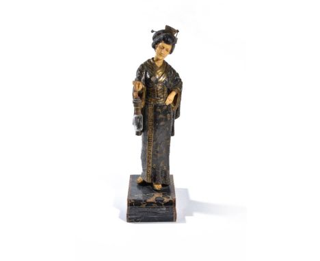 ‡ A continental decorated spelter and resinous faux ivory figural table lamp, 20th century, modelled as a Geisha holding a la