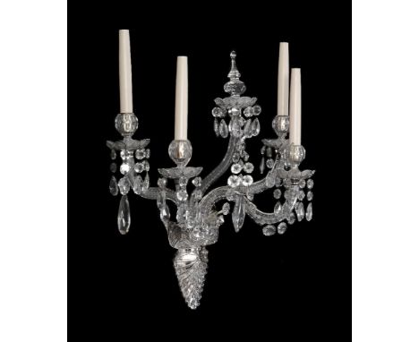 A pair of cut and moulded glass four light wall appliques, modern, the urn sockets on floral drip pans suspending faceted gla