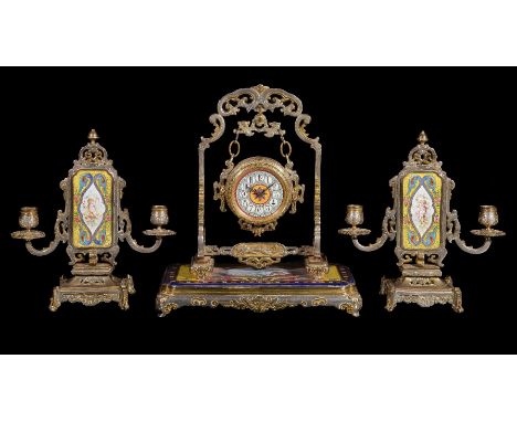 ‡A French gilt and painted metal timepiece garniture in Orientalist taste, final quarter 19th century, the eight-day back wou