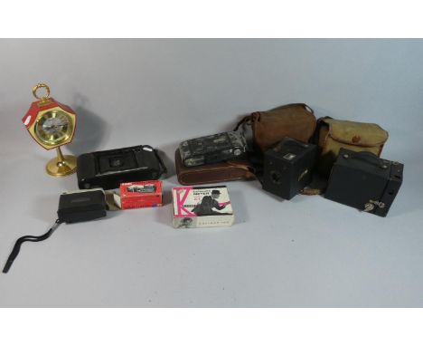A Box Containing Vintage Cameras and Exposure Meters, 1960's Japanese Mantle Clock etc 
