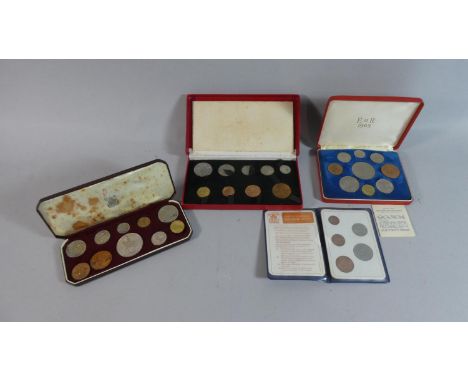 Three Cased Sets of British Coins and a Britain's First Decimal Coin set 