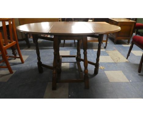 An Oval Top Oak Drop Leaf Gate Legged Dining Table, 89.5cm Wide 