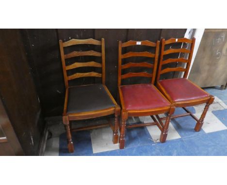 A Set of Three Stained Ladder Back Dining Chairs 