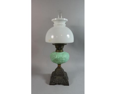 A Late Victorian Brass Based Oil Lamp with Opaque Green Glass Reservoir Decorated in Relief with Birds and Flowers, Total Hei