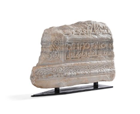 A FRAGMENTARY MARBLE FUNERARY MONUMENT  NORTH AFRICA, ISLAMIC, CIRCA 11TH-12TH CENTURY A.D.  Decorated on both sides with a p