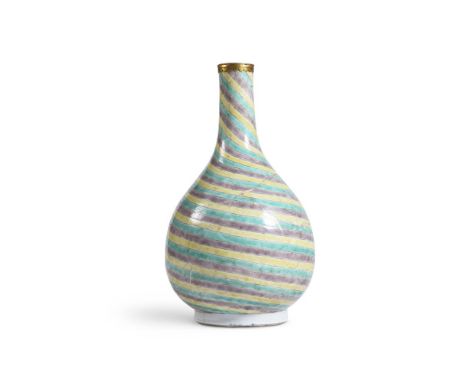A CHINESE FAMILLE VERTE BOTTLE VASE KANGXI (1662-1722) With yellow, green and aubergine spiral glazes, the base white 25.5cm 