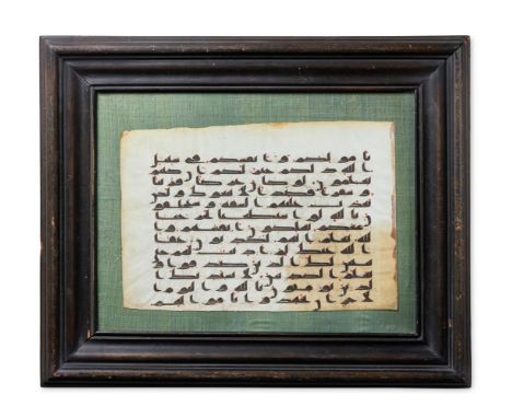 A KUFIC QUR'AN FOLIO LEAF  NORTH AFRICA OR NEAR EAST, 8TH CENTURY  On green linen backing in later glazed ebonised frame  the