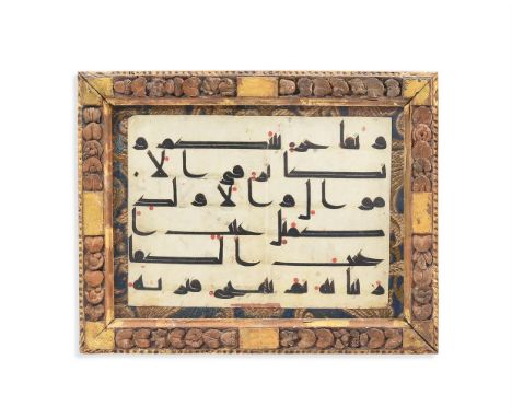 A KUFIC QUR'AN FOLIO LEAF  NORTH AFRICA OR NEAR EAST On vellum, in a carved and parcel-gilt frame 17 x 23cmProvenance: Christ