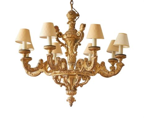 A CARVED GILTWOOD EIGHT LIGHT CHANDELIER  FRENCH, AFTER ANDRE-CHARLES BOULLE, EARLY 18TH CENTURY AND LATER The baluster shaft