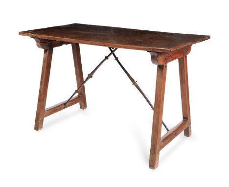 A WALNUT TRESTLE OR CENTRE TABLE  SPANISH, 18TH CENTURY  The trestle supports hinged, hooks to the top of the iron crossed st