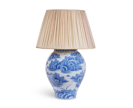 A BLUE AND WHITE GLAZED VASE GERMAN, LATE 17TH CENTURY AND LATER FITTED AS A LAMP  Decorated with figures in a landscape, wit