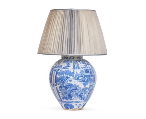 A BLUE AND WHITE FAIENCE OVOID JAR IN TRANSITIONAL STYLE  DUTCH OR NORTH GERMAN, CIRCA 1700 AND LATER FITTED AS A LAMP With a