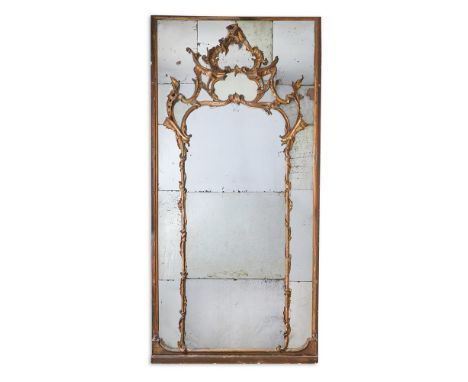 A GILTWOOD MIRROR  NORTH ITALIAN, PIEDMONT, THIRD QUARTER 18TH CENTURY  The mirror plate sectional  246cm high, 121cm wide   