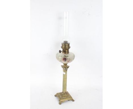 19th century oil lamp with a clear glass chimney going down to a frosted and coloured glass reservoir with brass Corinthian&n