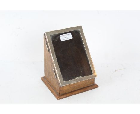 Oak box with a single door with a silver picture frame hallmarked for Birmingham dated 1946, 15cm high 12cm deep&nbsp;