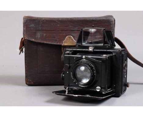 An Ernemann&nbsp;Miniature Klapp Strut Folding Plate Camera, serial no 1119922, circa 1923, 6 x 4.5cm, body G-VG, focusing sc