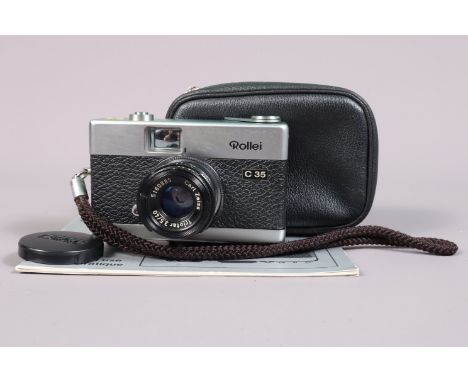 A Rollei C35 Compact Camera, made in Germany, shutter working, body G-VG, with Carl Zeiss 40mm f/3.5 Triotar lens, serial no 