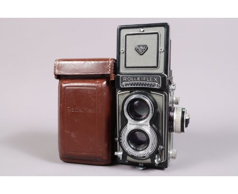 A Rolleiflex T TLR Camera, grey, with exposure meter, serial no T 2130498, shutter sluggish on slow speeds,, meter responsive