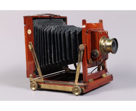 A Thornton Pickard Imperial Triple Extension Half Plate Field Camera, tapered chamfered-corner black bellows, focusing screen