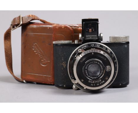 A Nagel Pupille Roll Film Camera, serial no 87694, format 3 x 4cm on 127 film, body G, Compur shutter no 2340107, circa 1933,