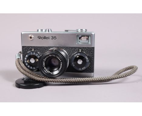 A Rollei 35 Compact Camera, made in Singapore, shutter working, meter functions, body G-VG, with Carl Zeiss 40mm f/3.5 Tessar