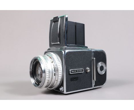 A Hasselblad 500C/M Camera, chrome, serial no UUC 203485, shutter working, body G-VG, light scratches to base, with Carl Zeis